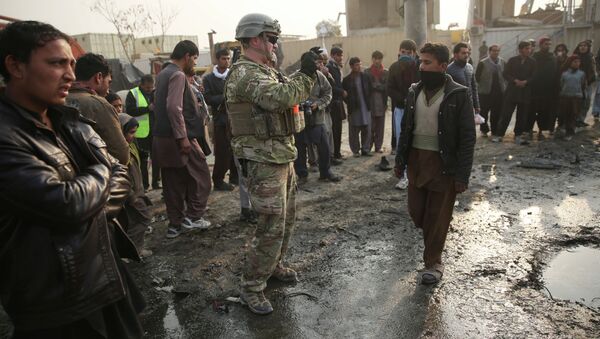 A US soldier at the site of a suicide car bomb attack in Kabul, Afghanistan. - Sputnik International
