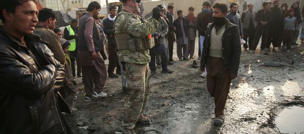 A US soldier at the site of a suicide car bomb attack in Kabul, Afghanistan. A US soldier at the site of a suicide car bomb attack in Kabul, Afghanistan. - Sputnik International