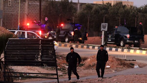Jordanian security stand guard outside Swaqa prison, after the executions of Sajida al-Rishawi and Ziad al-Karbouly, two Iraqis linked to al-Qaida, about 50 miles (80 kilometers) south of the Jordan's capital, Amman, Wednesday, Feb. 4, 2015. - Sputnik International