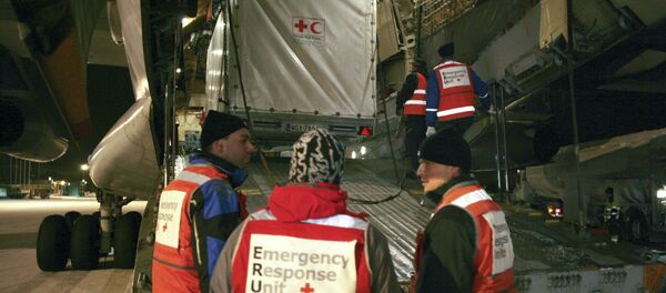 A mobile clinic of the Red Cross is being loaded onto a cargo plane in Tampere airport A mobile clinic of the Red Cross is being loaded onto a cargo plane in Tampere airport - Sputnik International