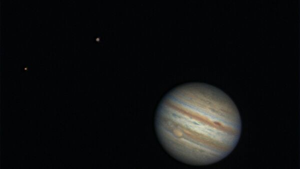 Jupiter, and it's two moons Europa and Ganymede. - Sputnik International