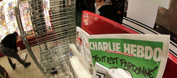 The latest issue of Charlie Hebdo newspaper at a newsstand - Sputnik International