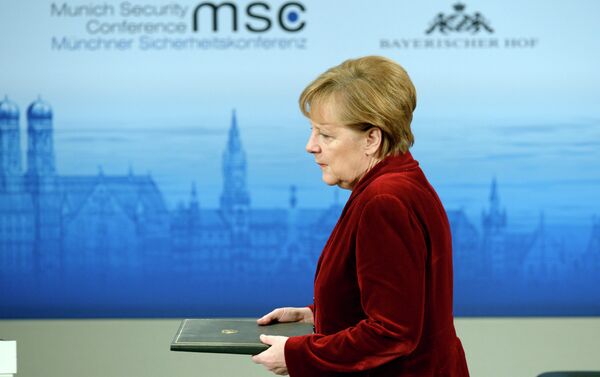 German Chancellor Angela Merkel enters the podium to deliver a speech during the 51st Munich Security Conference (MSC) in Munich - Sputnik International