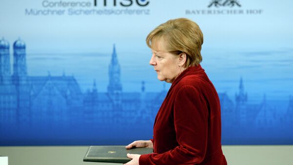 German Chancellor Angela Merkel enters the podium to deliver a speech during the 51st Munich Security Conference (MSC) in Munich - Sputnik International