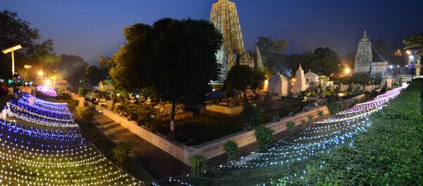 The Mahabodhi temple is illuminated with lights on the occassion of 10th Tipitaka Chanting for World Peace in Bodhgaya in Bihar The Mahabodhi temple is illuminated with lights on the occassion of 10th Tipitaka Chanting for World Peace in Bodhgaya in Bihar - Sputnik International