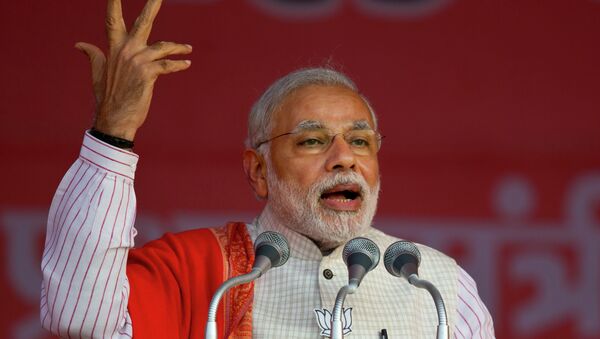 Indian Prime Minister Narendra Modi addresses an election campaign rally for his Bharatiya Janata Party (BJP) ahead of Delhi state election in New Delhi, India, Wednesday, Feb. 4, 2015 - Sputnik International