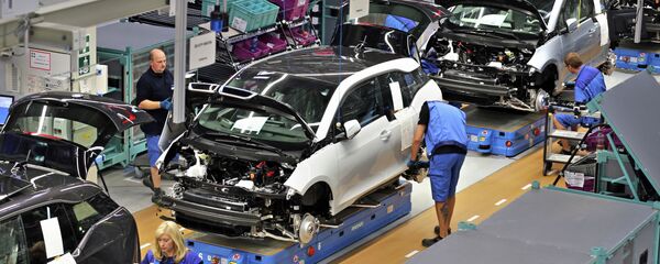 Employees of German carmaker BMW work on the production of the new electrical vehicle i3 at the plant in Leipzig Employees of German carmaker BMW work on the production of the new electrical vehicle i3 at the plant in Leipzig - Sputnik International