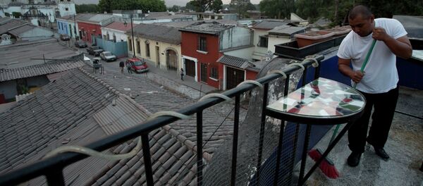 A waiter sweeps the ash covered terrace of a restaurant, from the eruption of the Fuego Volcano at Antigua Guatemala, Saturday, Feb. 7, 2015 A waiter sweeps the ash covered terrace of a restaurant, from the eruption of the Fuego Volcano at Antigua Guatemala, Saturday, Feb. 7, 2015 - Sputnik International