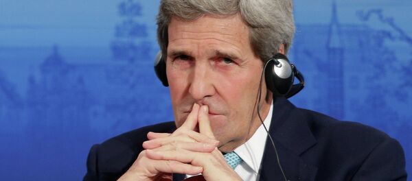 U.S. Secretary of State John Kerry listens to a speech of German Foreign Minister Frank-Walter Steinmeier on the podium during the 51. Security Conference in Munich, Germany, Sunday, Feb. 8, 2015 - Sputnik International