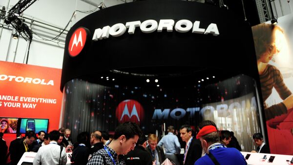 Participants are seen in a Motorola stand at the Mobile World Congress, the world's largest mobile phone trade show, in Barcelona, Spain. - Sputnik International
