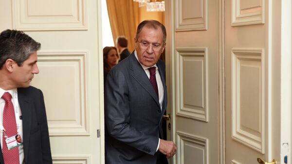 Russian Minister of Foreign Affairs Sergey Lavrov right, leaves a room after talks during the 51st Security Conference  in Munich, Germany, Sunday Feb. 8, 2015 - Sputnik International