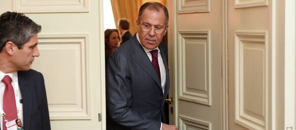 Russian Minister of Foreign Affairs Sergey Lavrov right, leaves a room after talks during the 51st Security Conference  in Munich, Germany, Sunday Feb. 8, 2015 - Sputnik International