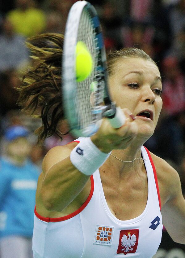 Agnieszka Radwanska of Poland returns the ball to Maria Sharapova of Russia during the Fed Cup World Group first round tennis match between Poland and Russia in Krakow, Poland, Sunday, Feb. 8, 2015 - Sputnik International