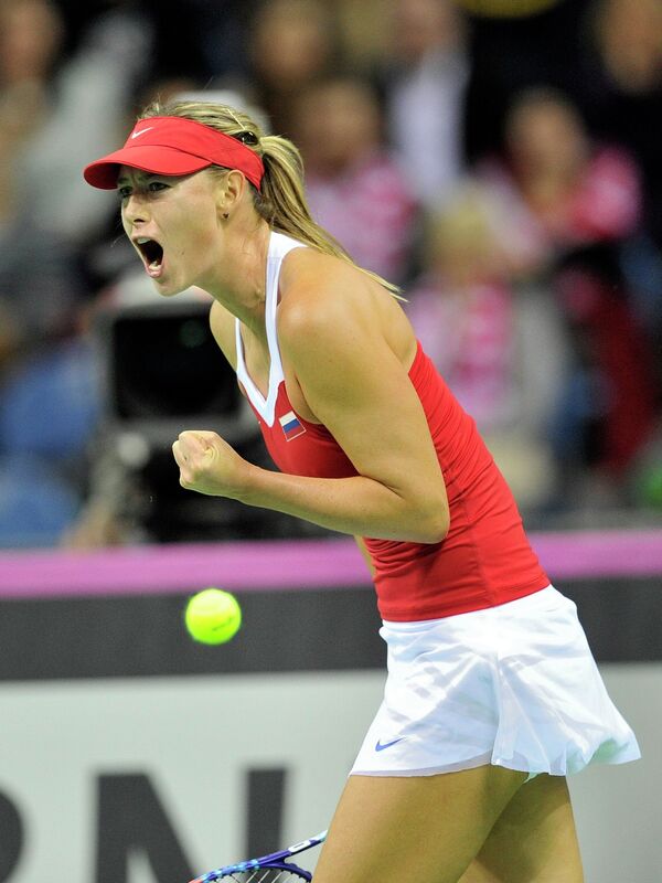 Russia's Maria Sharapova reacts during her match against Poland's Agnieszka Radwanska during their Fed Cup World Group 1st round tennis match between Poland and Russia in Krakow, Poland on February 8, 2015 - Sputnik International