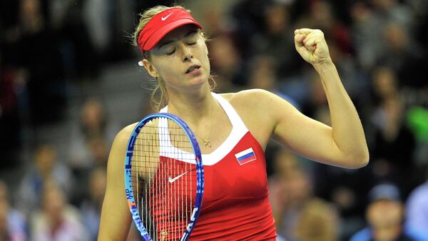 Russia's Maria Sharapova reacts during her match against Poland's Agnieszka Radwanska during their Fed Cup World Group 1st round tennis match between Poland and Russia in Krakow, Poland on February 8, 2015 - Sputnik International
