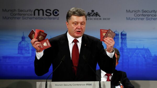 Ukrainian President Petro Poroshenko holds Russian passports meant to prove the presence of Russian troops in Ukraine as he addresses the 51st Munich Security Conference, February 7, 2015 - Sputnik International