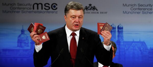Ukrainian President Petro Poroshenko holds Russian passports meant to prove the presence of Russian troops in Ukraine as he addresses the 51st Munich Security Conference, February 7, 2015 Ukrainian President Petro Poroshenko holds Russian passports meant to prove the presence of Russian troops in Ukraine as he addresses the 51st Munich Security Conference, February 7, 2015 - Sputnik International