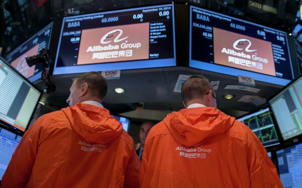Specialist traders work at the post that trades Alibaba Group Holding Ltd during the company's initial public offering (IPO) under the ticker BABA at the New York Stock Exchange in New York in this September 19, 2014 file photo - Sputnik International