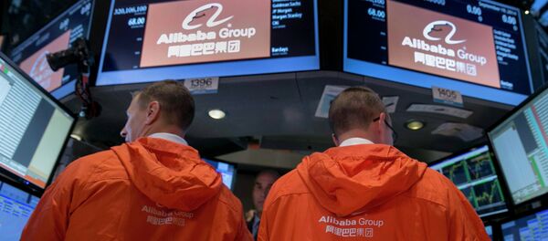 Specialist traders work at the post that trades Alibaba Group Holding Ltd during the company's initial public offering (IPO) under the ticker BABA at the New York Stock Exchange in New York in this September 19, 2014 file photo - Sputnik International