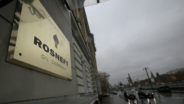 A plaque for the Rosneft Oli Company is seen outside the company headquarters in Moscow, Russia, in this file file photo dated Thursday, Oct. 18, 2012 - Sputnik International