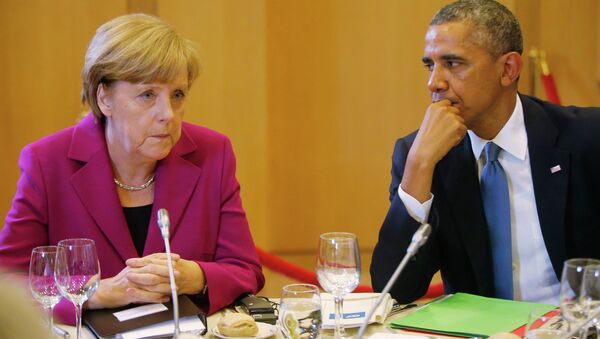 President Obama and Chancellor Merkel seated together at a G7 dinner in Brussels. - Sputnik International