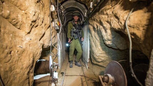 An Israeli army officer during an army-organised tour in a tunnel said to be used by Palestinian militants from the Gaza Strip. File photo - Sputnik International
