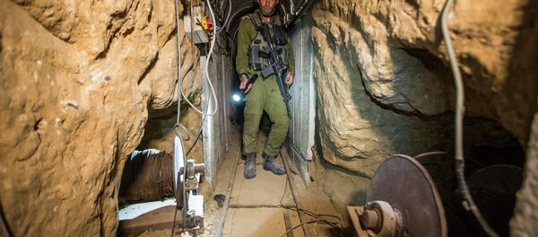 An Israeli army officer during an army-organised tour in a tunnel said to be used by Palestinian militants from the Gaza Strip. File photo An Israeli army officer during an army-organised tour in a tunnel said to be used by Palestinian militants from the Gaza Strip. File photo - Sputnik International