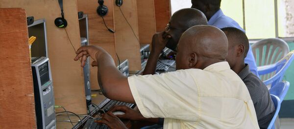 Local residents use computers at an internet cafe in Kinshasa. Local residents use computers at an internet cafe in Kinshasa. - Sputnik International