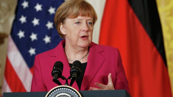 German Chancellor Angela Merkel speaks as she holds a joint news conference with U.S. President Barack Obama in the East Room of the White House in Washington February 9, 2015 - Sputnik International