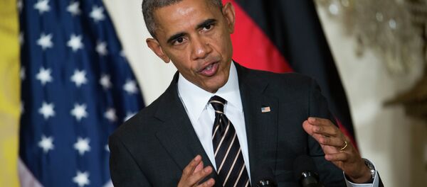 President Barack Obama gestures during a joint news conference with German Chancellor Angela Merkel in the East Room of the White House in Washington, Monday, Feb. 9, 2015 - Sputnik International