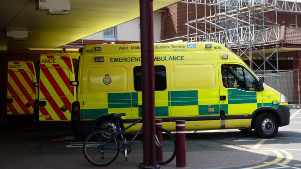 A row of NHS West Midlands Ambulance Service emergency ambulances, outside the Accident & Emergency department of Warwick Hospital. - Sputnik International