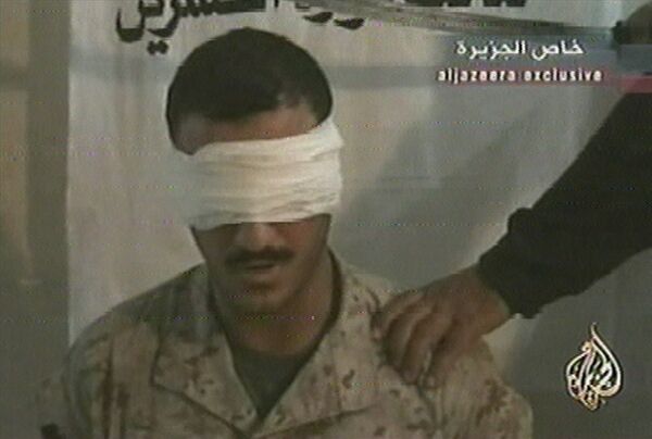 This image from a June 2004 video broadcast by the Al-Jazeera network shows a man identified as US Marine Wassef Ali Hassoun, who Iraqi militants claimed to have lured from his base and captured. This image from a June 2004 video broadcast by the Al-Jazeera network shows a man identified as US Marine Wassef Ali Hassoun, who Iraqi militants claimed to have lured from his base and captured. - Sputnik International