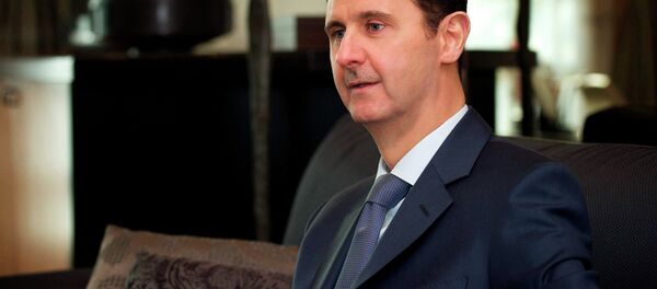 Syria's President Bashar al-Assad is seen during an interview with the American magazine Foreign Affairs published in Damascus January 26, 2015 Syria's President Bashar al-Assad is seen during an interview with the American magazine Foreign Affairs published in Damascus January 26, 2015 - Sputnik International