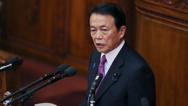 Japan's Finance Minister Taro Aso speaks during a opening session at the lower house of Parliament in Tokyo, Monday, Jan. 26, 2015 - Sputnik International