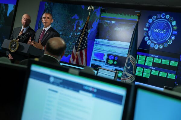 Homeland Security Secretary Jeh Johnson listens at left as President Barack Obama speaks at the National Cybersecurity and Communications Integration Center in Arlington, Va., Tuesday, Jan. 13, 2015 Homeland Security Secretary Jeh Johnson listens at left as President Barack Obama speaks at the National Cybersecurity and Communications Integration Center in Arlington, Va., Tuesday, Jan. 13, 2015 - Sputnik International
