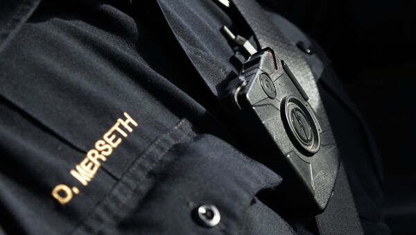 In this Feb. 2, 2015 photo, police officer Dan Merseth wears one of Duluth, Minnesota's 110 officer-worn cameras. Demand for the devices is booming after last summer's unrest in Ferguson, Mo., and cities are already wrestling with whether they can afford to equip all their officers and how often the cameras should be turned off to reduce the video recorded. - Sputnik International