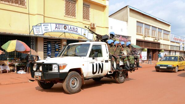 UN peacekeeping soldiers from Rwanda patrol on December 09, 2014 in Bangui - Sputnik International