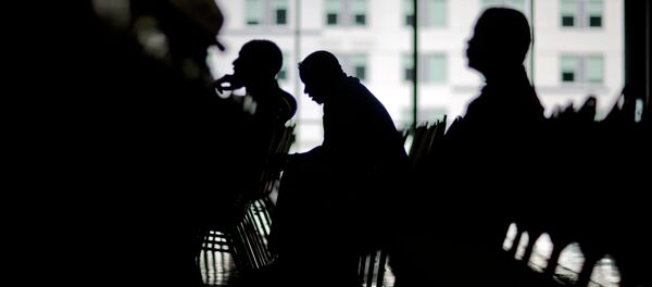 Homeowners wait to speak with a bank associate in an attempt to lower their monthly mortgage payments Homeowners wait to speak with a bank associate in an attempt to lower their monthly mortgage payments - Sputnik International