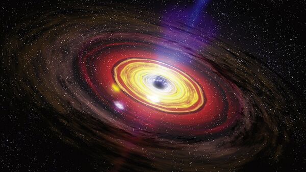 Supermassive black holes, the largest type of black hole, are usually found at the center of large galaxies.  - Sputnik International