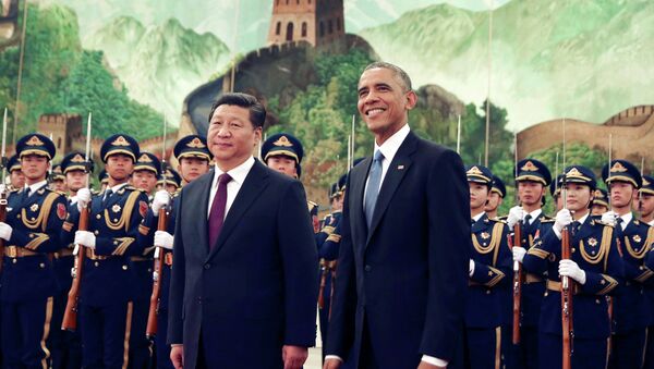 US President Barack Obama stands next to Chinese President Xi Jinping at the Great Hall of the People in Beijing, China. - Sputnik International
