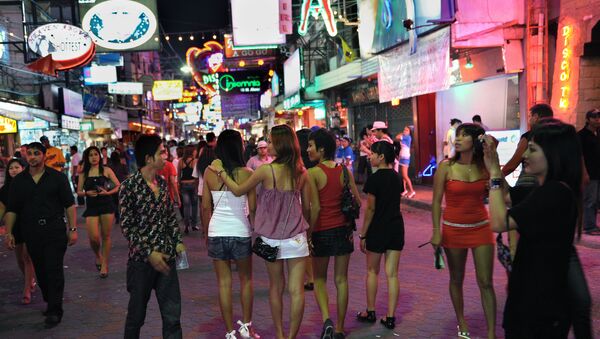 Men and women walk in the red light district in Pattaya, Thailand - Sputnik International