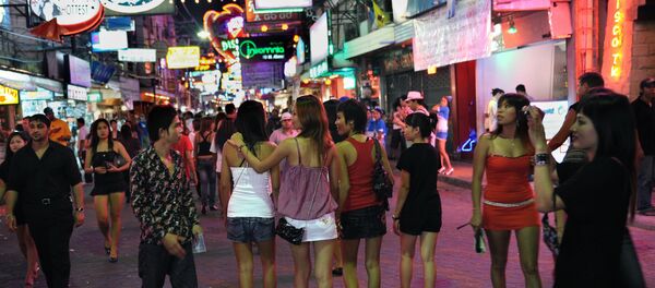 Men and women walk in the red light district in Pattaya, Thailand - Sputnik International