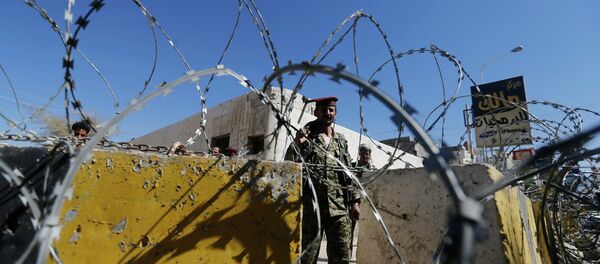 A soldier stands guard behind a roadblock A soldier stands guard behind a roadblock - Sputnik International