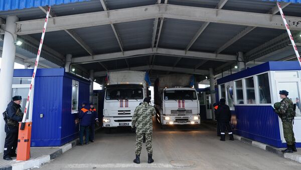 Russia's 14th humanitarian aid convoy for southeast Ukraine at the Matveyev Kurgan border crossing checkpoint - Sputnik International