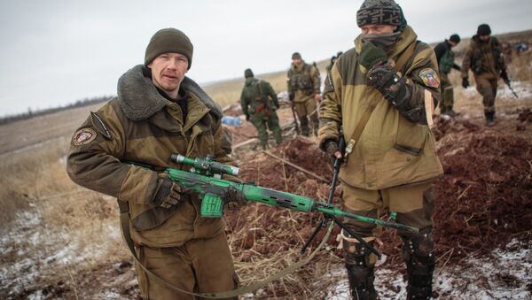 Self-defense fighters of the Donetsk People's Republic in a combat position near the village of Mala Horlivka in the Donetsk Region - Sputnik International