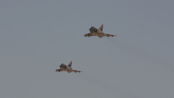 Two Egyptian Air Force Mirage fighter jets execute a bombing run - Sputnik International