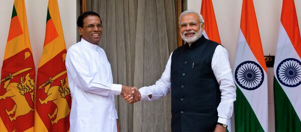 Sri Lanka’s President Maithripala Sirisena, left, and Indian Prime Minister Narendra Modi shake hands as they pose for photos before their meeting in New Delhi, India, Monday, Feb. 16, 2015 Sri Lanka’s President Maithripala Sirisena, left, and Indian Prime Minister Narendra Modi shake hands as they pose for photos before their meeting in New Delhi, India, Monday, Feb. 16, 2015 - Sputnik International
