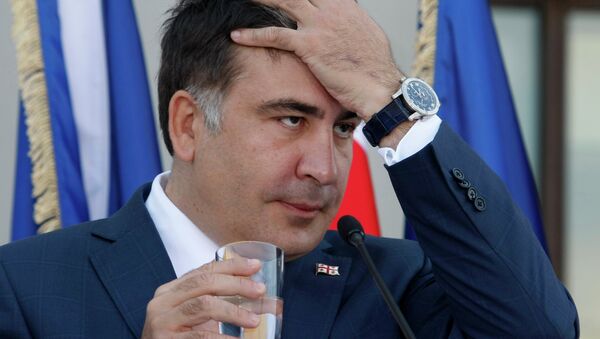 Georgian President Mikhail Saakashvili gestures during a news conference with NATO Secretary General Anders Fogh Rasmussen in the presidential palace in Tbilisi on June 27, 2013 - Sputnik International