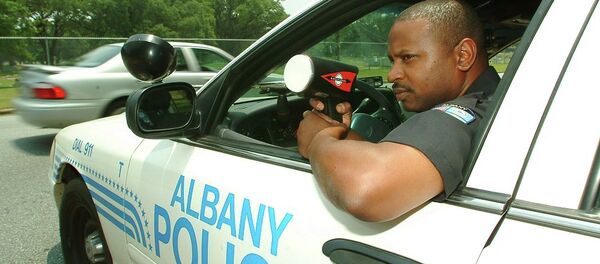 Albany police Cpl. Robert Ponder clocks traffic on a south Albany, Ga. street, Thursday, June 23, 2005, in Albany, Ga. Ponder Albany police Cpl. Robert Ponder clocks traffic on a south Albany, Ga. street, Thursday, June 23, 2005, in Albany, Ga. Ponder - Sputnik International