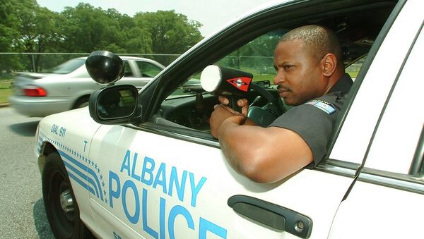 Albany police Cpl. Robert Ponder clocks traffic on a south Albany, Ga. street, Thursday, June 23, 2005, in Albany, Ga. Ponder - Sputnik International